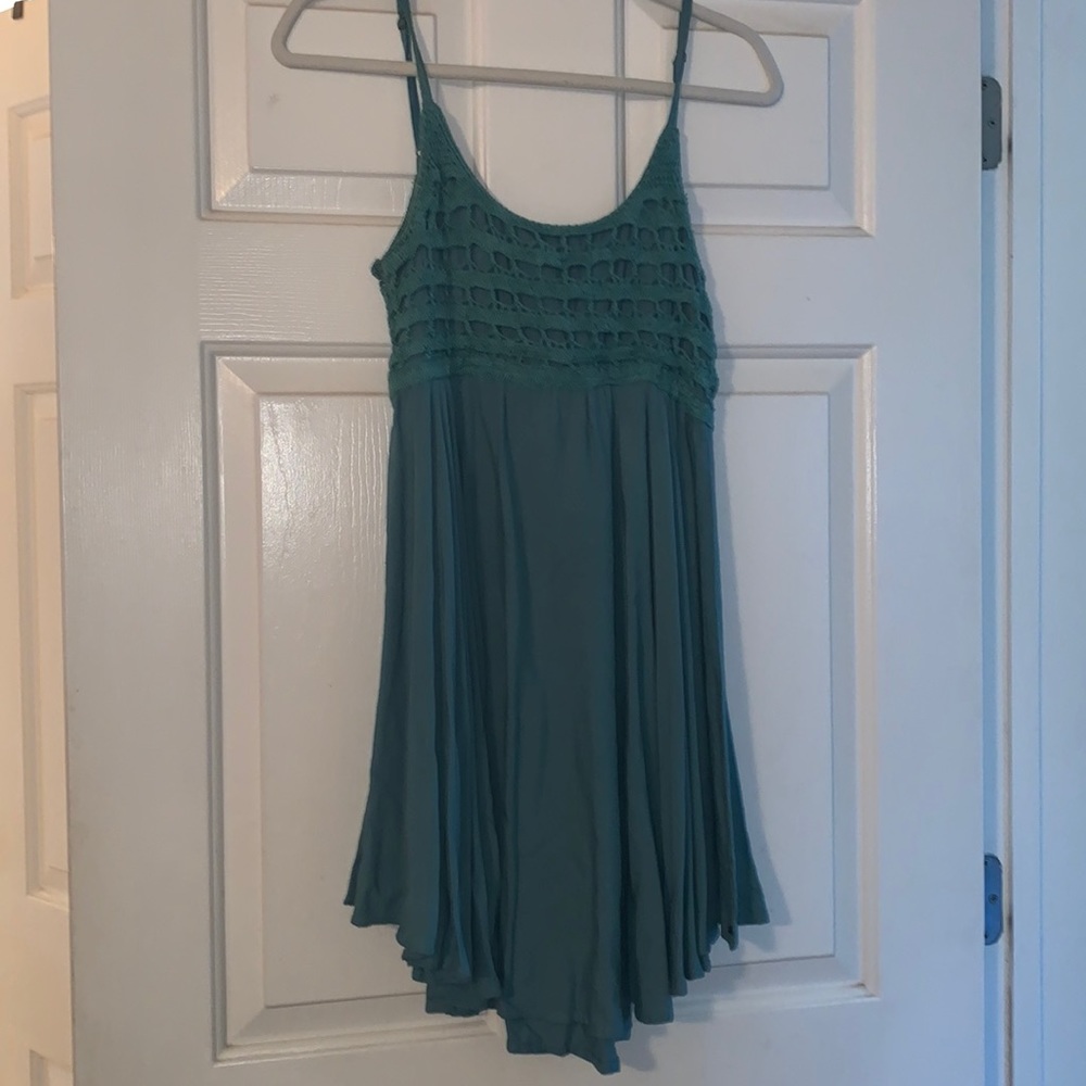 Green mini flowy dress with crochet detail